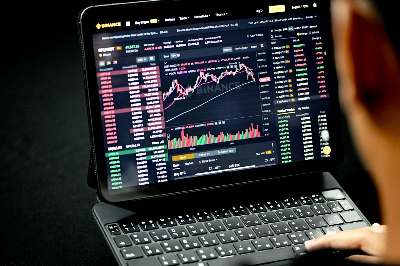 A man is looking at a trading site